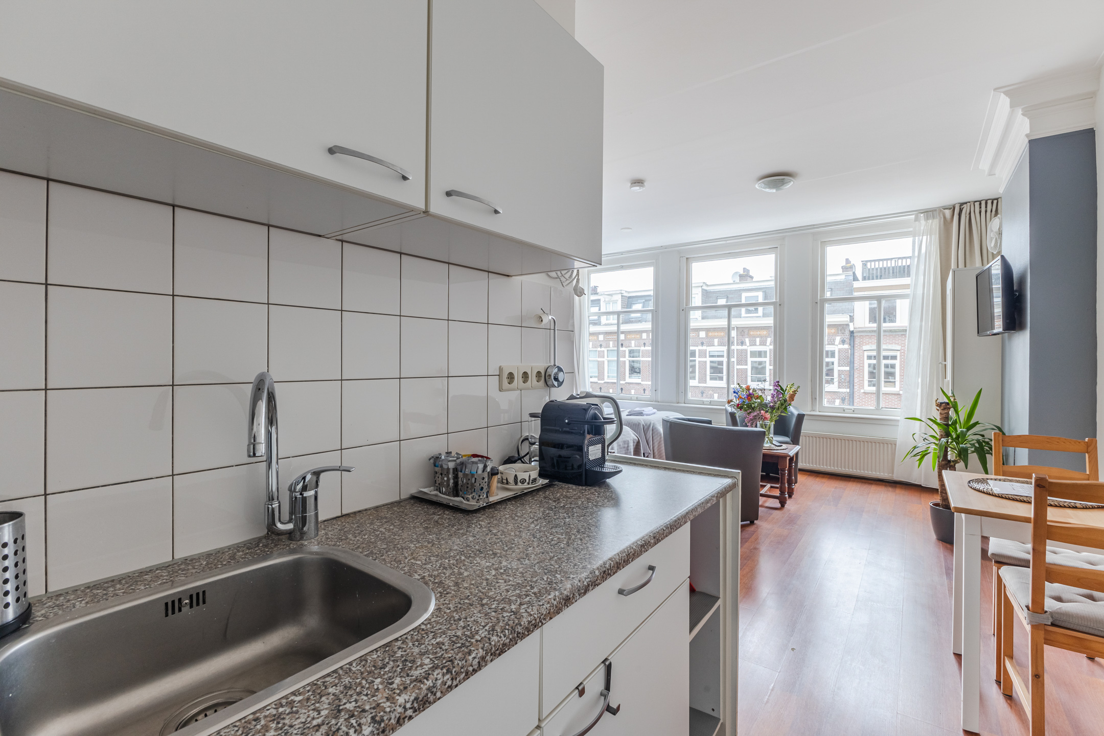 Kitchen with View of Dining and Living Area Albert Cuypstraat III B studio Amsterdam